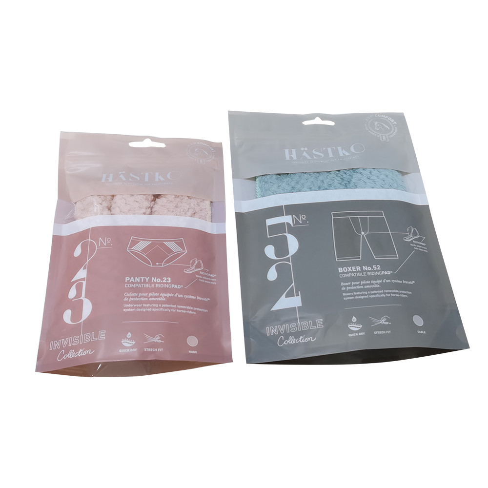 Design di imballaggi tessili per abiti in amido di mais certificato Finestra trasparente biodegradabile personalizzata con borsa per calzini Doypack con foro per appendere